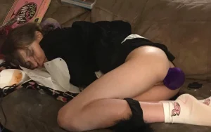 Sexy girl with purple bunny tail butt plug asleep